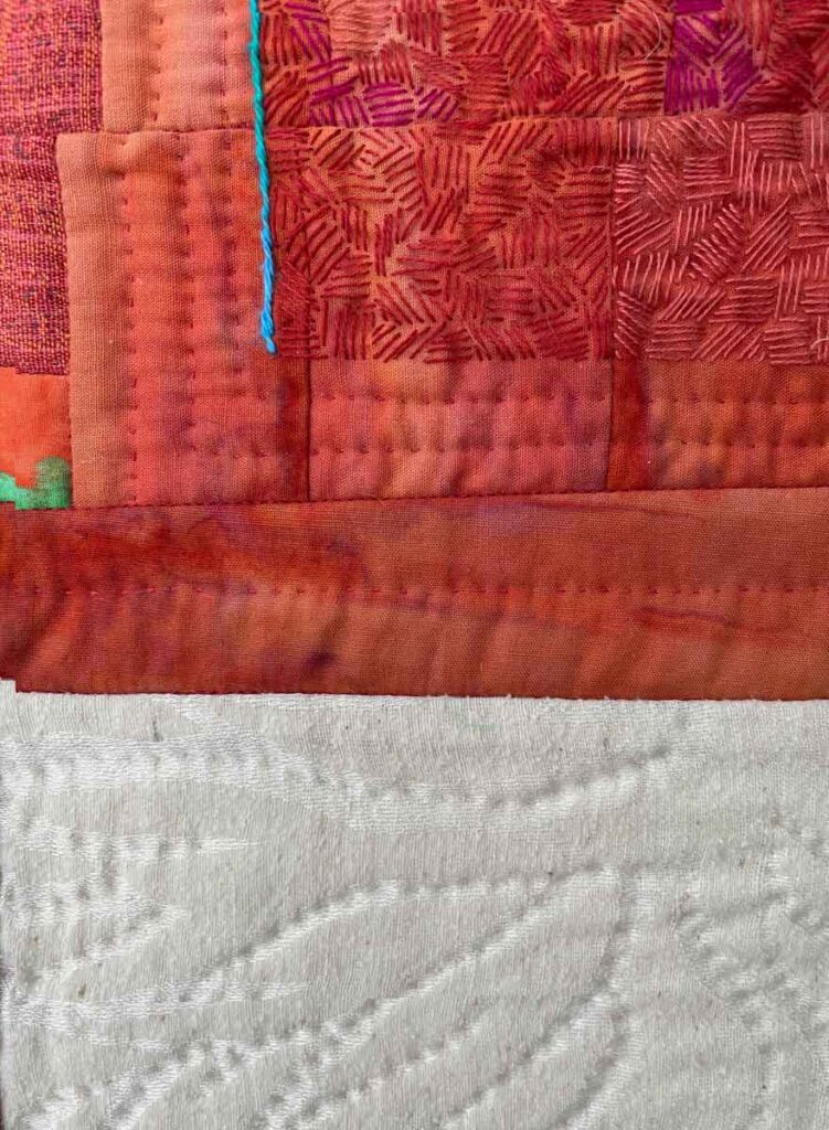 Compartmentalized, detail quilted and embroidered